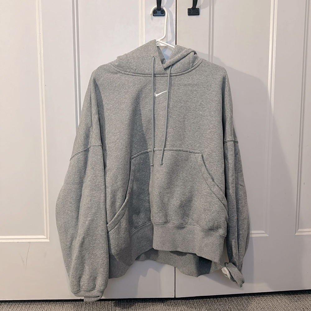 Woman’s oversized grey Nike hoodie